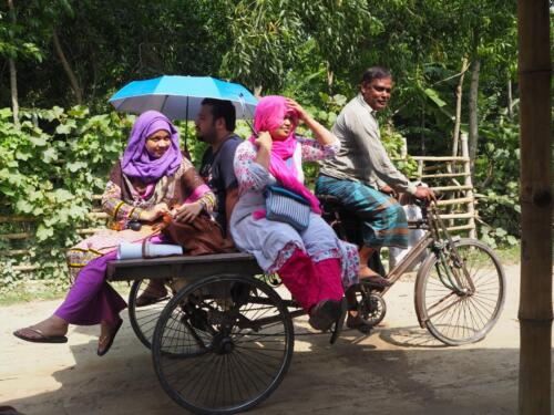 Participants of the session enjoying a van ride through the streets of Jessore